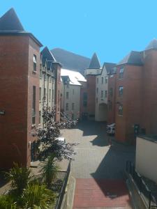 an empty street in a city with buildings at Apt 7A Waterfoot Apartment in Newcastle