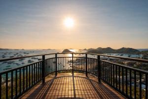 a balcony with a view of the water and boats at Ocha Bajo Homestay in Komodo Labuan Bajo Airport