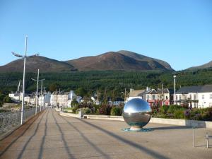 a large silver ball on a street in a town at Apt 7A Waterfoot Apartment in Newcastle