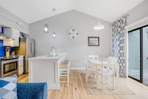 a kitchen and dining room with a table and chairs at Sea Colony - 6301 Private in Bethany Beach +28 photos