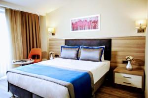 a bedroom with a large bed in a hotel room at Restwon Suite Hotel in Istanbul
