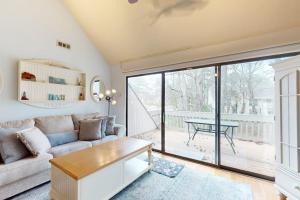 a living room with a couch and a table at Sea Colony --- 2203 Round Robin in Bethany Beach