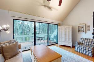 a living room with a couch and a table at Sea Colony --- 2203 Round Robin in Bethany Beach