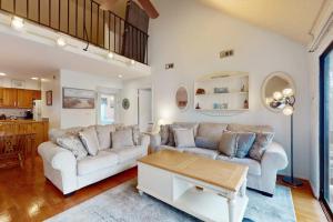 a living room with a couch and a table at Sea Colony --- 2203 Round Robin in Bethany Beach