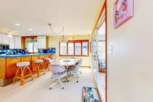 a kitchen with a table and chairs in a room at South Bethany --- 301 W 2nd St in Bethany Beach