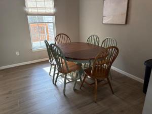 a wooden table and chairs in a room at South Hampton --- 38118 E Chester Ln in Ocean View