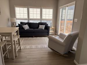 a living room with a couch and a chair at South Hampton --- 38118 E Chester Ln in Ocean View +15 photos