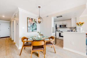 a kitchen and dining room with a table and chairs at Sea Colony - 708 Brandywine House in Bethany Beach