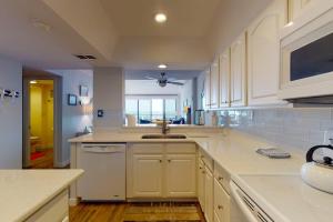 a large kitchen with white cabinets and a sink at Sea Colony - 2F Brandywine Garden Rd in Bethany Beach +28 photos