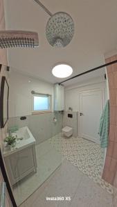 a bathroom with a sink and a toilet at Domki Śluza 23 in Dywan +13 photos