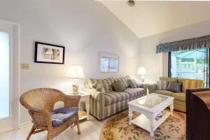 a living room with a couch and a table at Sea Colony - 9603 Timberlake in Bethany Beach