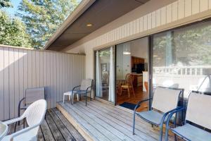a porch with chairs and a table on a deck at Sea Colony - 4003 Volley in Bethany Beach