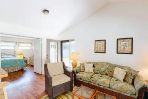 a living room with a couch and a bedroom at Sea Colony - 4003 Volley in Bethany Beach