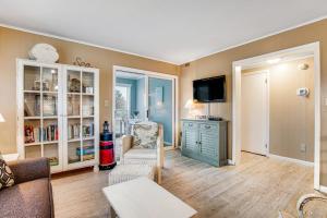 a living room with a couch and a tv at Bethany Meadows - 2A Briar North in Frankford