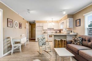 a living room with a couch and a kitchen at Bethany Meadows - 2A Briar North in Frankford
