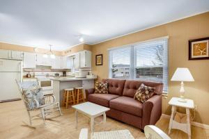 a living room with a couch and a kitchen at Bethany Meadows - 2A Briar North in Frankford