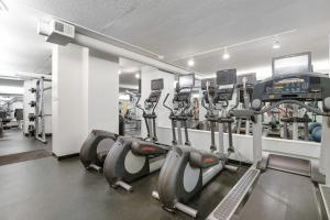 a gym with rows of cardio machines in a room at Sea Colony - 507 Georgetown House in Bethany Beach
