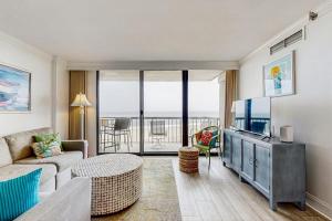 a living room with a couch and a tv at Sea Colony - 507 Georgetown House in Bethany Beach