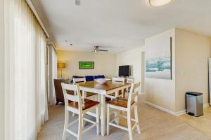 a dining room with a table and chairs at Rainbow Cove --- 117 Dagsworthy Ave #B in Dewey Beach