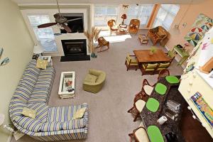 an overhead view of a living room with a couch and furniture at Swann Cove - 36858 Herring in Selbyville