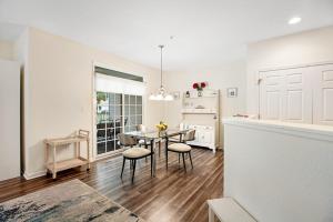 a kitchen and dining room with a table and chairs at Bear Trap Dunes --- 45A Willow Oak in Ocean View