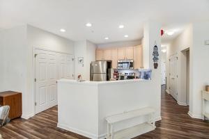 a kitchen with white cabinets and a counter top at Bear Trap Dunes --- 45A Willow Oak in Ocean View