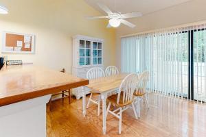 a dining room with a table and chairs at Sea Colony -- 8901 Timberlake in Bethany Beach