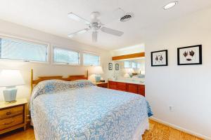 a bedroom with a bed and a ceiling fan at Sea Colony -- 8901 Timberlake in Bethany Beach +21 photos