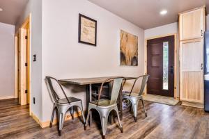 a dining room with a table and chairs at A Place To Gather in Tomahawk