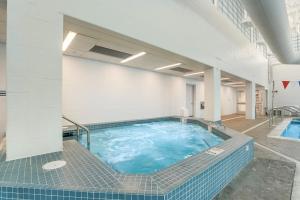 a large swimming pool in a large building at Sea Colony - 709 Brandywine House Rd in Bethany Beach