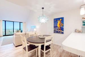 a dining room and living room with a table and chairs at Sea Colony - 2D Brandywine Garden House Rd in Bethany Beach