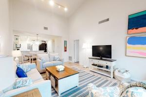 a living room with a couch and a tv at Sea Colony - 2D Brandywine Garden House Rd in Bethany Beach