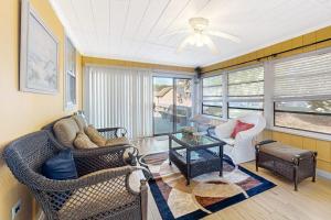 a living room with a couch and a table at 112 Loganberry Lane in Rehoboth Beach