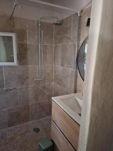 a bathroom with a shower and a sink at Casa Olea in Sartène +11 photos