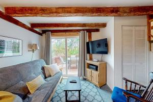 a living room with a couch and a tv at Running Fox Farm in Baraboo