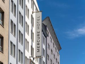 a hotel sign on the side of a building at Hotel Mercure Wien City in Vienna +83 photos