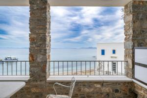 a balcony with a view of the ocean at Moutsouna Seaside in Moutsoúna +34 photos