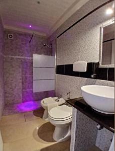 a bathroom with a white toilet and a sink at B&B I like salento in Uggiano la Chiesa +33 photos