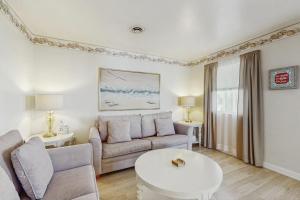 a living room with a couch and a table at 37534 Lighthouse Rd #202 in Fenwick Island