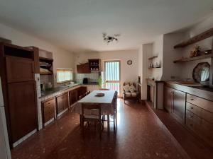 a kitchen with a table in the middle of it at Beautiful Dreams in San Giorgio a Liri