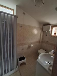 a bathroom with a shower and a toilet and a sink at Beautiful Dreams in San Giorgio a Liri +16 photos