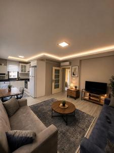 a living room with a couch and a table at Trabzon Albayrak Suite in Trabzon