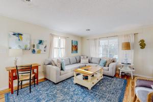 a living room with a couch and a table at Rehoboth Beach Anna B St in Rehoboth Beach