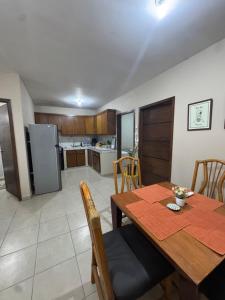 a kitchen and dining room with a table and chairs at Departamento #10 in San Carlos