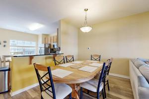 a dining room and kitchen with a table and chairs at Rehoboth Crossing 19915 Ames Dr in Rehoboth Beach