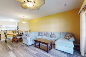 a living room with a couch and a table at Rehoboth Crossing 19915 Ames Dr in Rehoboth Beach