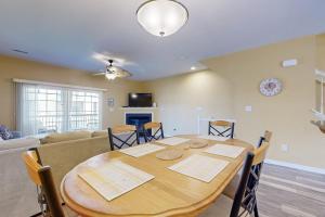 a dining room with a table and a couch at Rehoboth Crossing 19915 Ames Dr in Rehoboth Beach +17 photos