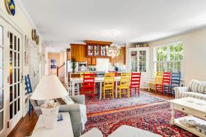 a living room and kitchen with a table and chairs at Rehoboth Beach --- 6 Holly Road in Rehoboth Beach