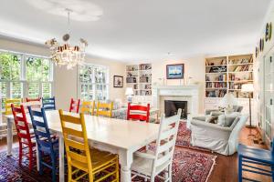 a dining room with a table and chairs and a fireplace at Rehoboth Beach --- 6 Holly Road in Rehoboth Beach