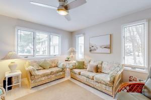 a living room with two couches and windows at Bethany Pines --- 428 Bethany Pines in Bethany Beach